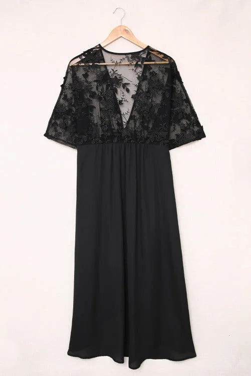 Black dress with lace detailing on a white background