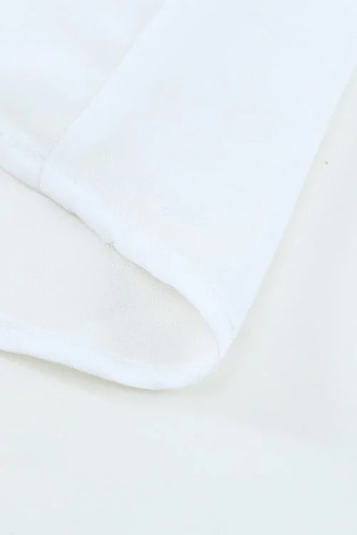 Close-up of white fabric on a beige background